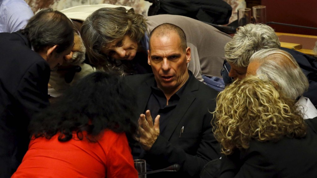 Greek Finance Minister Varoufakis speaks to other lawmakers during a parliamentary session in Athens